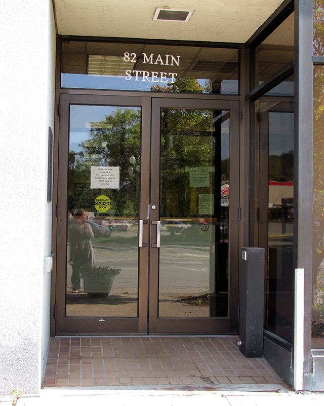 A set of double doors to the court facility.  There is pole with a push button on the right side.
