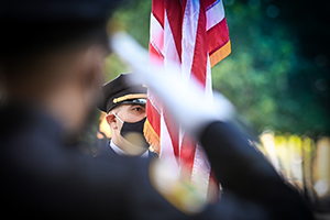 Court Officer salutes the U.S. flag