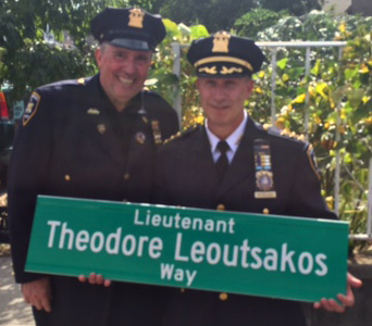 Court Officers holding sign for Lieutenant Theodore Leoutsakos Way