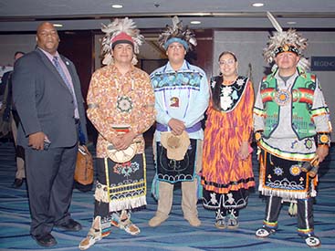 people in traditional Native American clothing