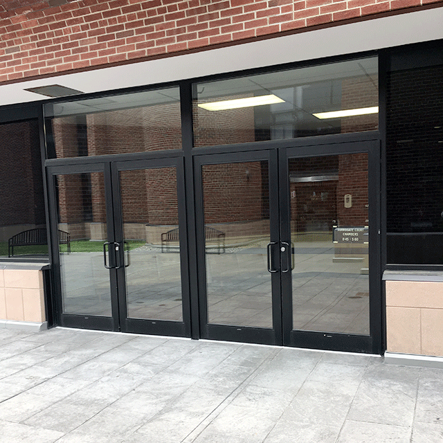 Two double doors entry to the court facility. The door is accessed directly from the sidewalk.