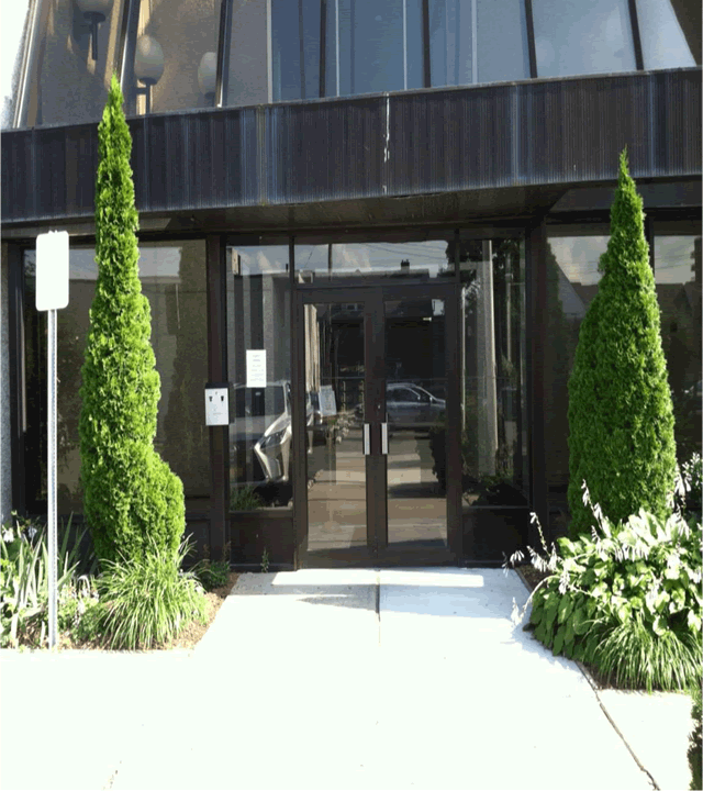 Court facility with a double door entrance; entrance can be accessed directly from the sidewalk.
