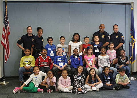 court officers and children pose