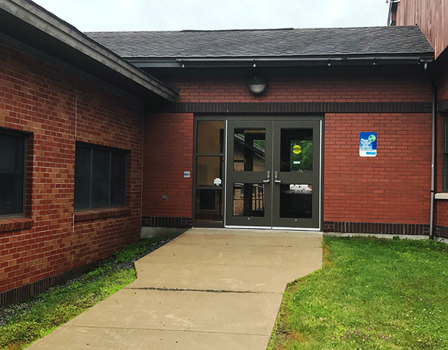 Hamilton County Court Offices inc. Surrogate, Family, County with a walkway that leads to a set of double doors.