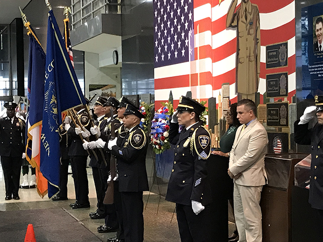 Photo of 9-11 Ceremony with Court Officers at attention.