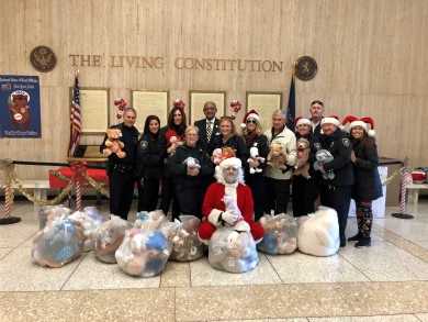 court officers deliver teddy bears