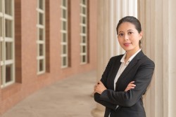 Young Female Court Employee poised to assist and learn