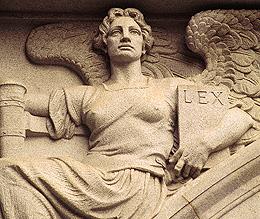 Photo of architectural relief, Angel holding book titled LEX.